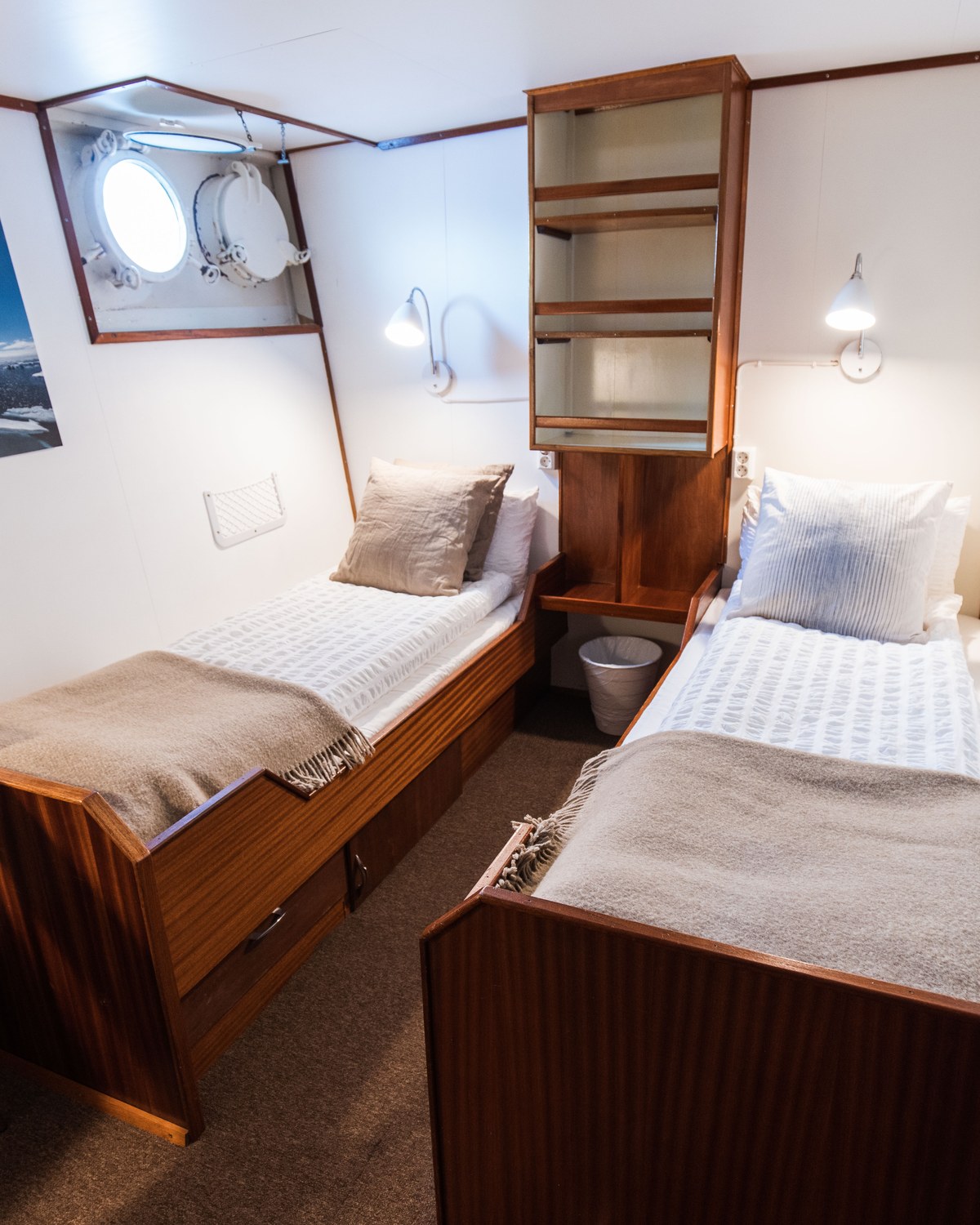 Guest cabin with porthole on board R/V Kinfish